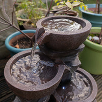 AllPondSolutions four-tier cascading bowl water feature with LED light