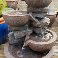 AllPondSolutions four-tier cascading bowl water feature with LED light