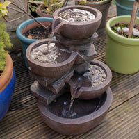 AllPondSolutions four-tier cascading bowl water feature with LED light