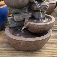AllPondSolutions four-tier cascading bowl water feature with LED light