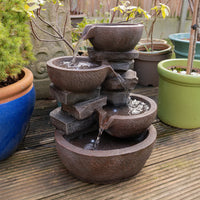 AllPondSolutions four-tier cascading bowl water feature with LED light