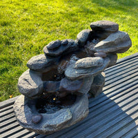 AllPondSolutions rock waterfall solar water feature with LED lights