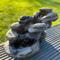 AllPondSolutions rock waterfall solar water feature with LED lights